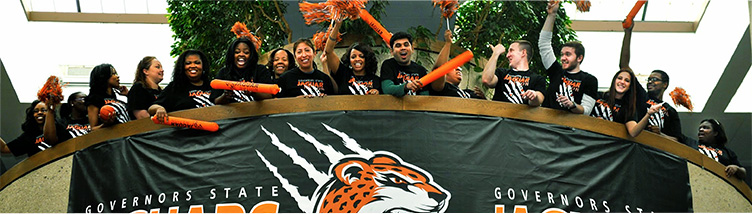 Students sitting outside at main entrance